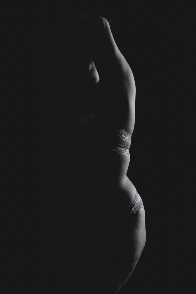 Bodyscapes photo of a woman's body. Photo by Gabby Jockers Photography. Nudescapes, nude, black and white, high contrast, low key light, boudoir, boudoir photography, sensual photos, Colorado boudoir, Denver Boudoir, Golden Boudoir, boudoir studio, elegant photography, abstract