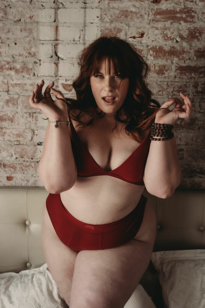 Woman standing wearing a matching red bralette and panties. Photo by Embodied Art Boudoir. A healthy relationship with food, mindful eating, love your food, non-judgemental, food freedom, anti-diet, self-compassion, mindfulness, self-love, dietary needs, slow down, appreciate food, appreciate life, colorado boudoir, denver boudoir, boulder boudoir, colorado springs boudoir, boudoir ideas, boudoir poses, boudoir inspiration
