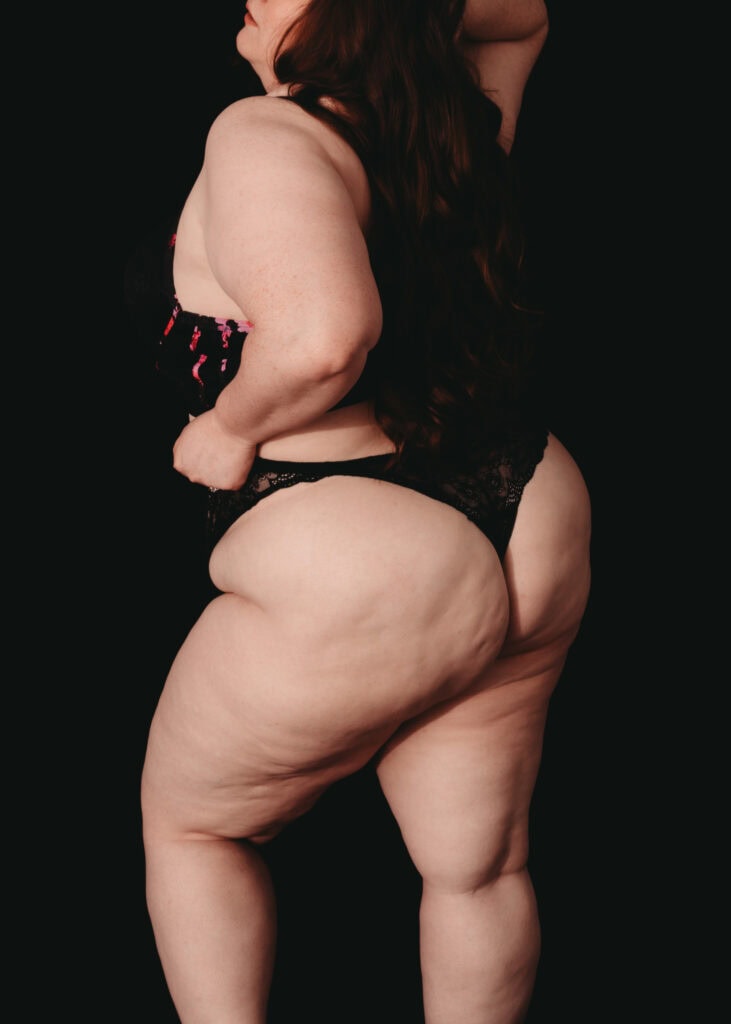 Woman standing in thong, showcasing her body. Photo by Embodied Art Boudoir. Body positivity, Body positive, love yourself, love your body, body acceptance, growth, self-acceptance, women's beauty, inner beauty, goddess, challenge societal standards, redefine beauty, champion diversity, every body is beautiful, colorado boudoir, denver boudoir, boulder boudoir, colorado springs boudoir, boudoir ideas, boudoir poses, boudoir inspiration, photography inspiration