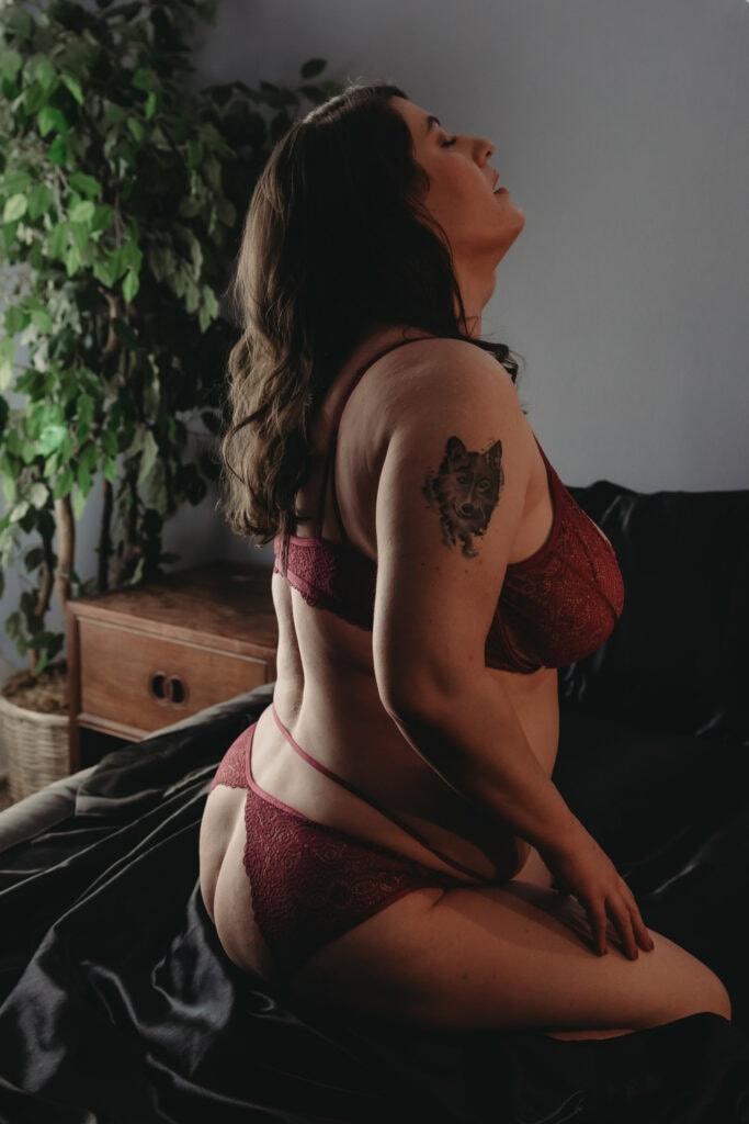 Woman kneeling on bed wearing a matching thong and bra in red. Photo by Embodied Art Boudoir. Holistic living, diet, lifestyle, intuitive eating, eat well, mindfulness, tips and tricks, healthy living, listen to your body, colorado boudoir, denver boudoir, boulder boudoir, colorado springs boudoir.